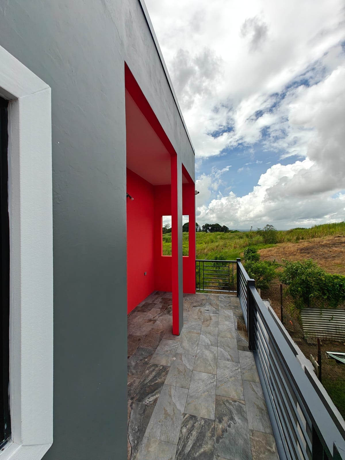Halo Place apartment balcony overlooking eastern Trinidad
