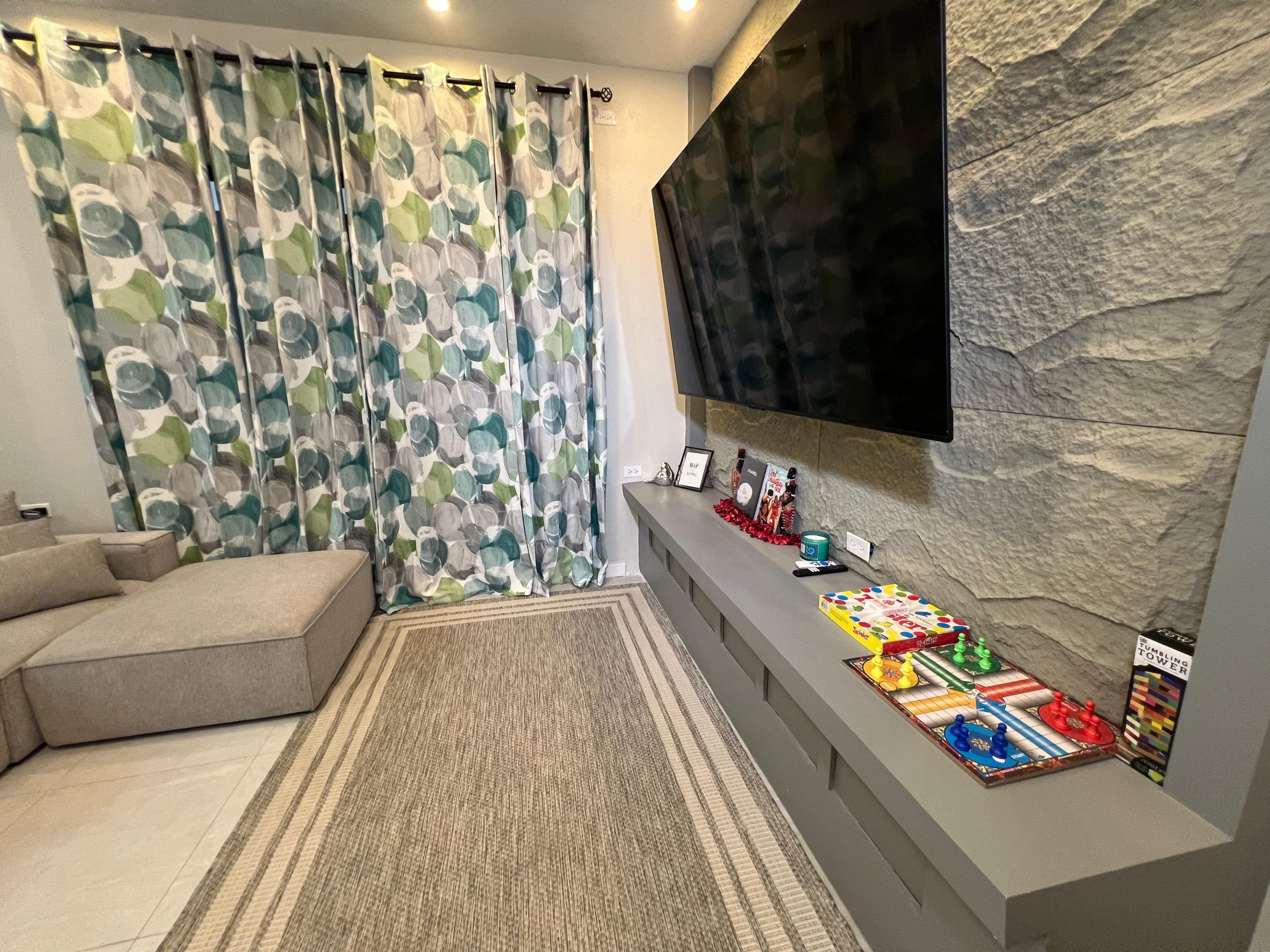 Halo Place living room with board games short-term rental Trinidad