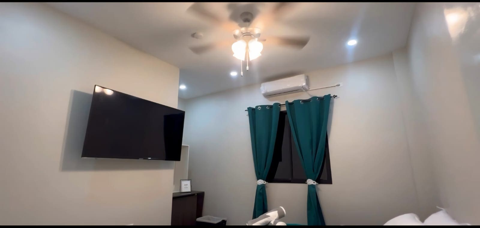 Halo Place second bedroom queen bed TV air conditioning Trinidad rental