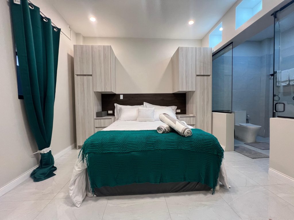 Halo Condo master bedroom king bed glass wall eastern Trinidad